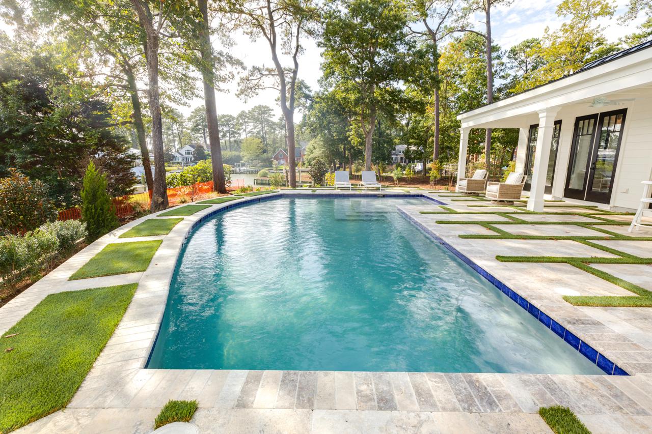 Elegant home rear exterior with view of pool | Exterior Gallery | Stephen Alexander Homes | Chesapeake, VA