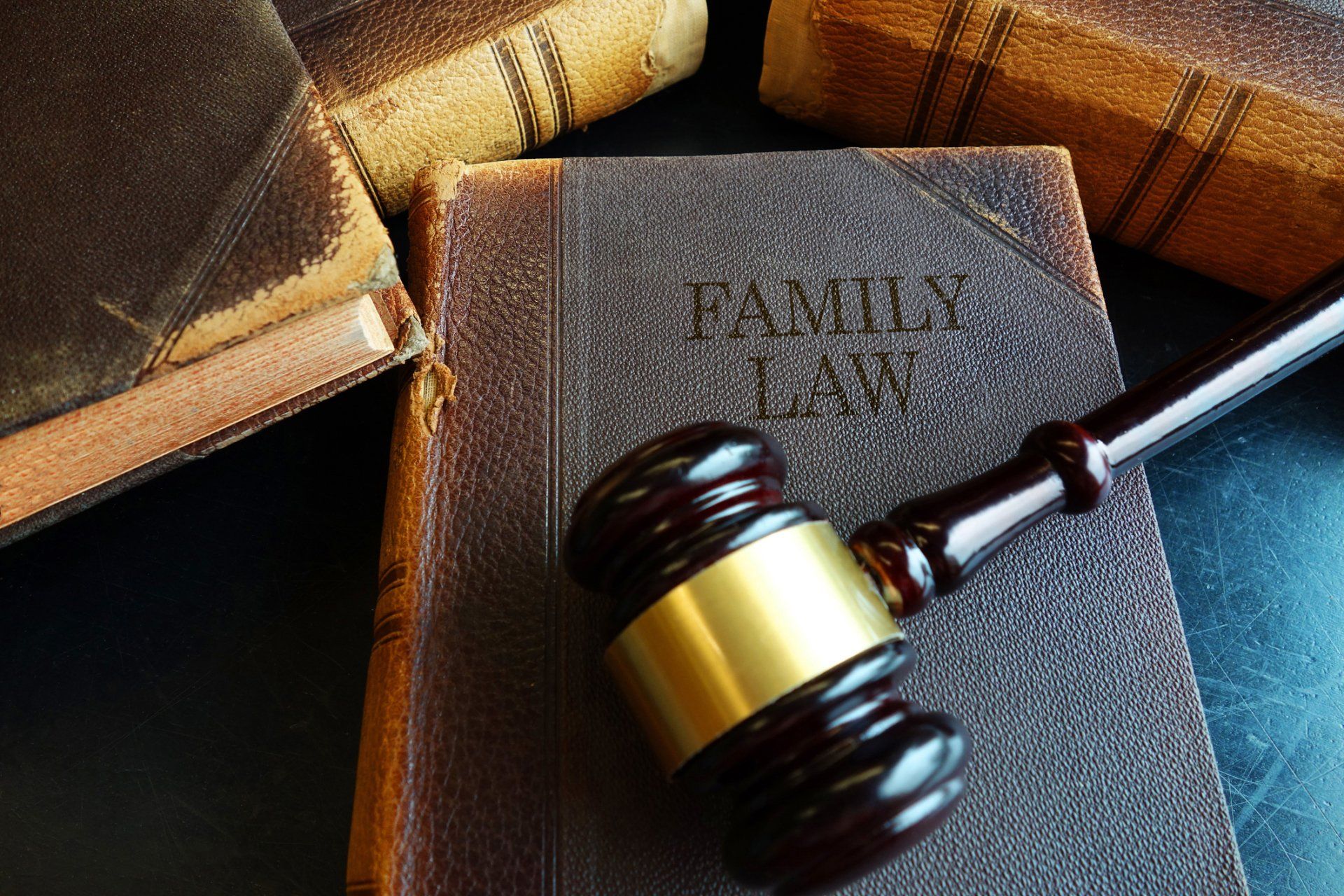Property Division — Wooden Gavel and Books on Wooden Table in Hutchinson, KS