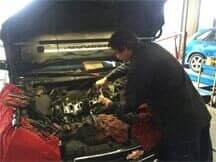Auto Repair - Green's Towing and Auto Repair in Valparaiso, IN A technician working on automotive repairs near Valparaiso, IN