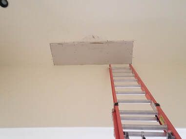 Hanged a 5 by 2 foot sheet of drywall on a high ceiling