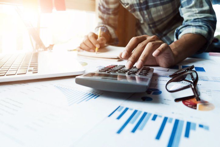 man making calculations