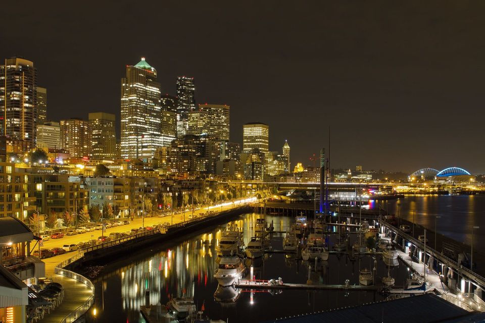 Downtown Seattle at night downtown Seattle commercial buildings at night. They are bright because of commercial electrical contractors