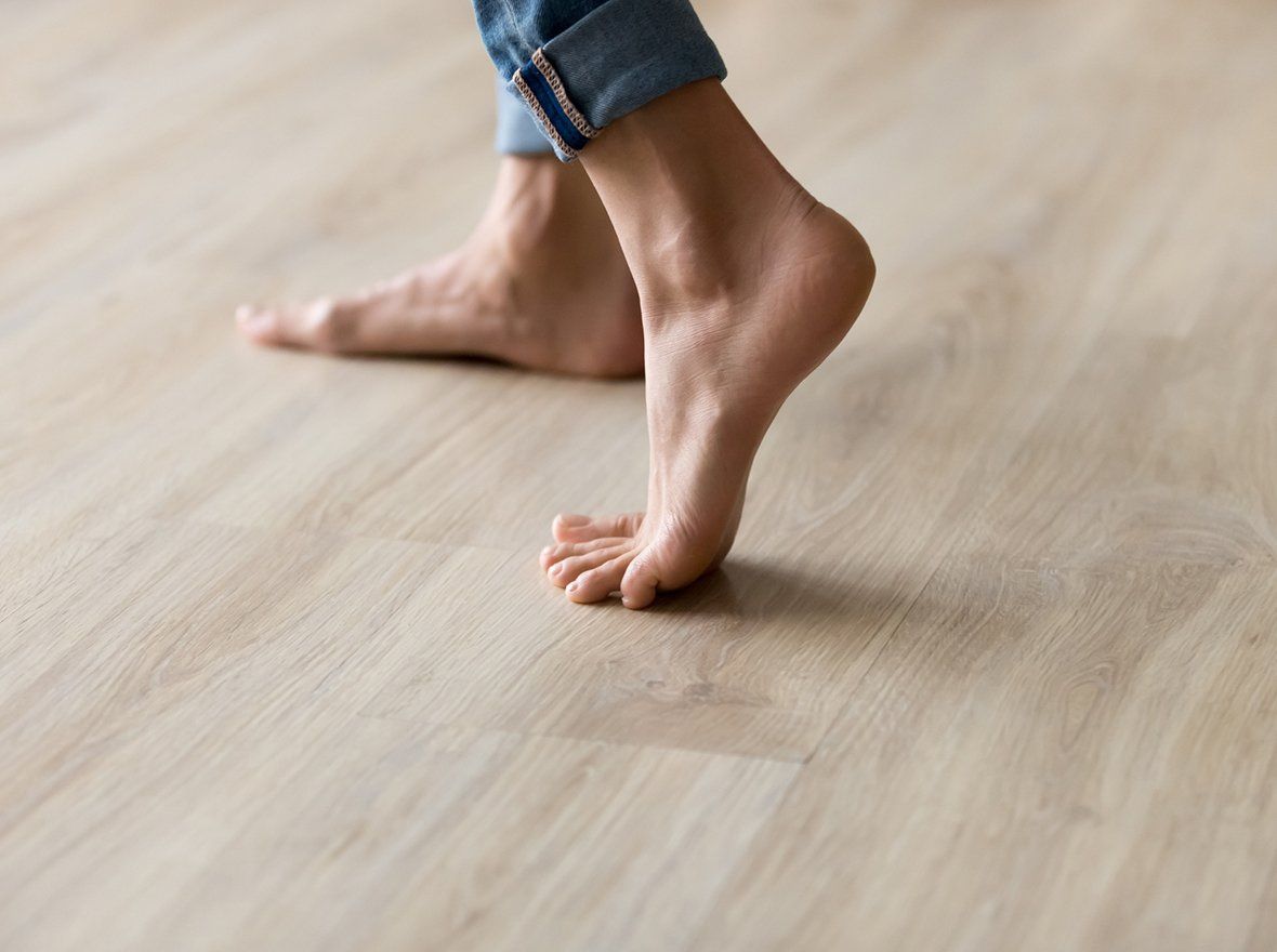 Person Walking in Hardwood Floor — Odessa, TX — Crenshaw Flooring Person Walking in Hardwood Floor — Odessa, TX — Crenshaw Flooring