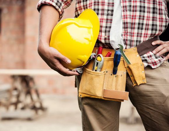 A Worker Holding His Helmet — Hugo, MN — Titan Exteriors A Worker Holding His Helmet — Hugo, MN — Titan Exteriors