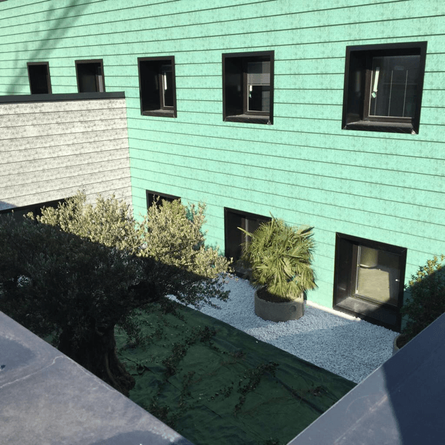 Rivestimento di facciata realizzata con lastra ondulata in alluminio