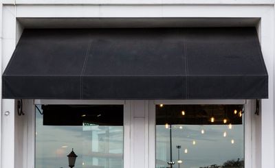 Black awning over cafe windows