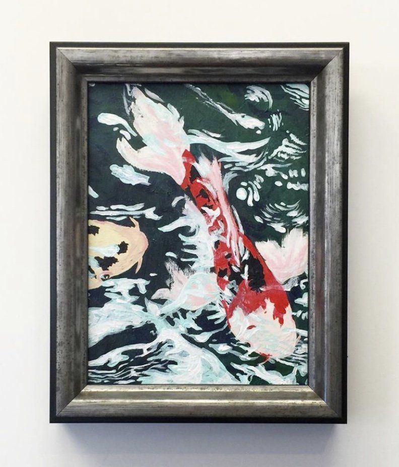 A framed painting of a red, white, and black koi fish swimming through dark water with light reflections.