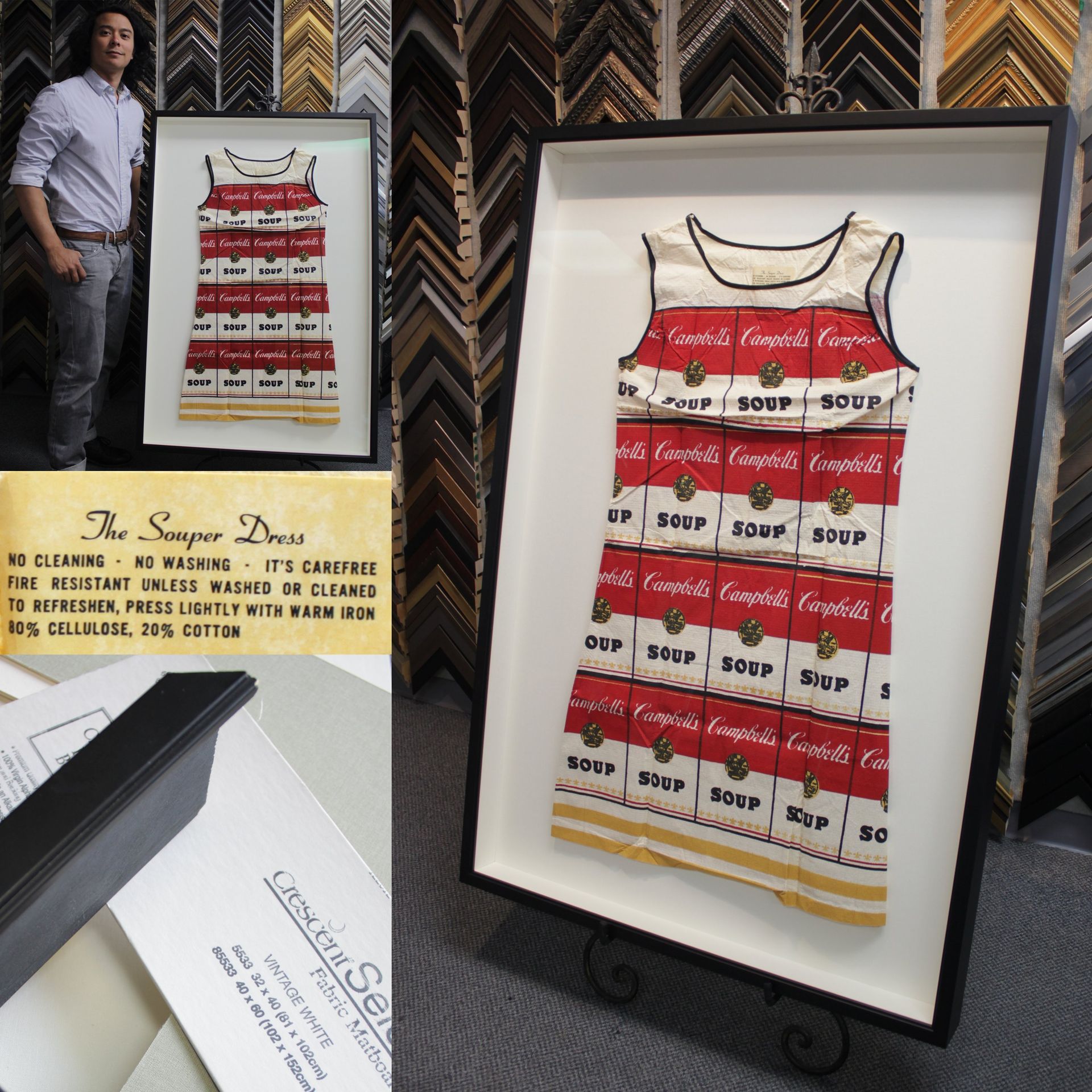 A person stands next to a framed 