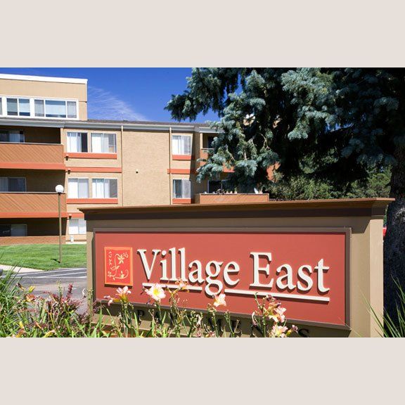 Village East permanent sign in parking lot