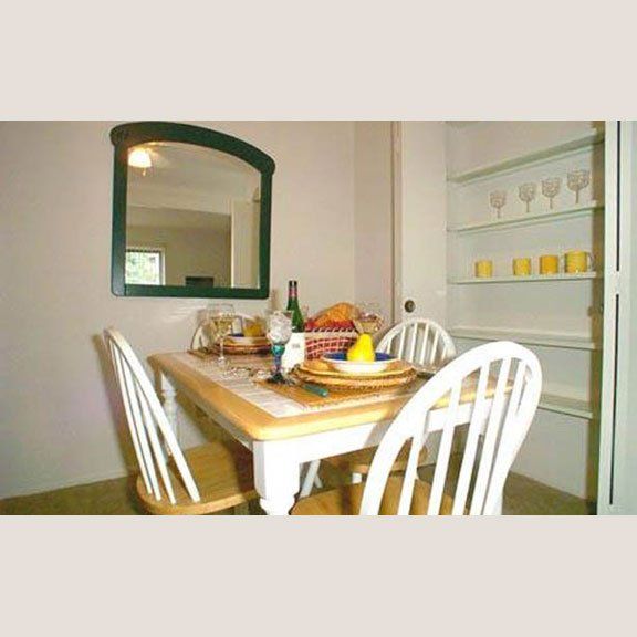 Wooden dining table with plates set