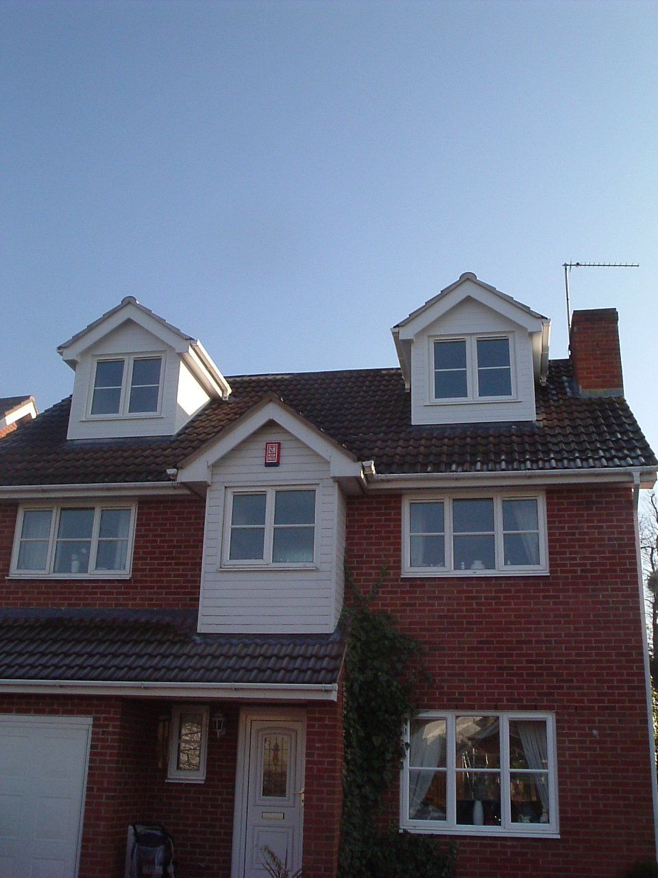 A brick house with the number 3 on the front