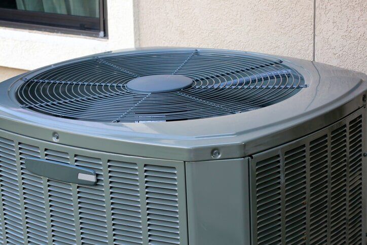 Air Conditioning — HVAC unit outside the building Air Conditioning — HVAC unit outside the building