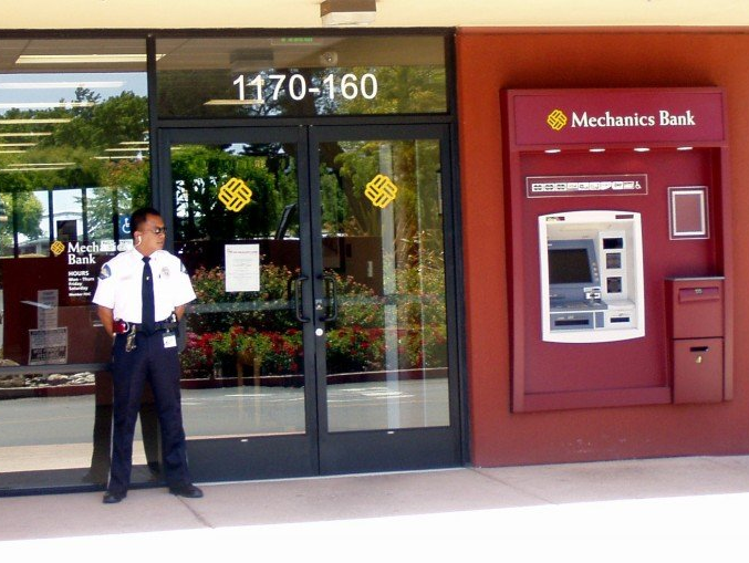 Security Services — Professional Security Office Standing Outside Gate in Concord, CA Security Services — Professional Security Office Standing Outside Gate in Concord, CA
