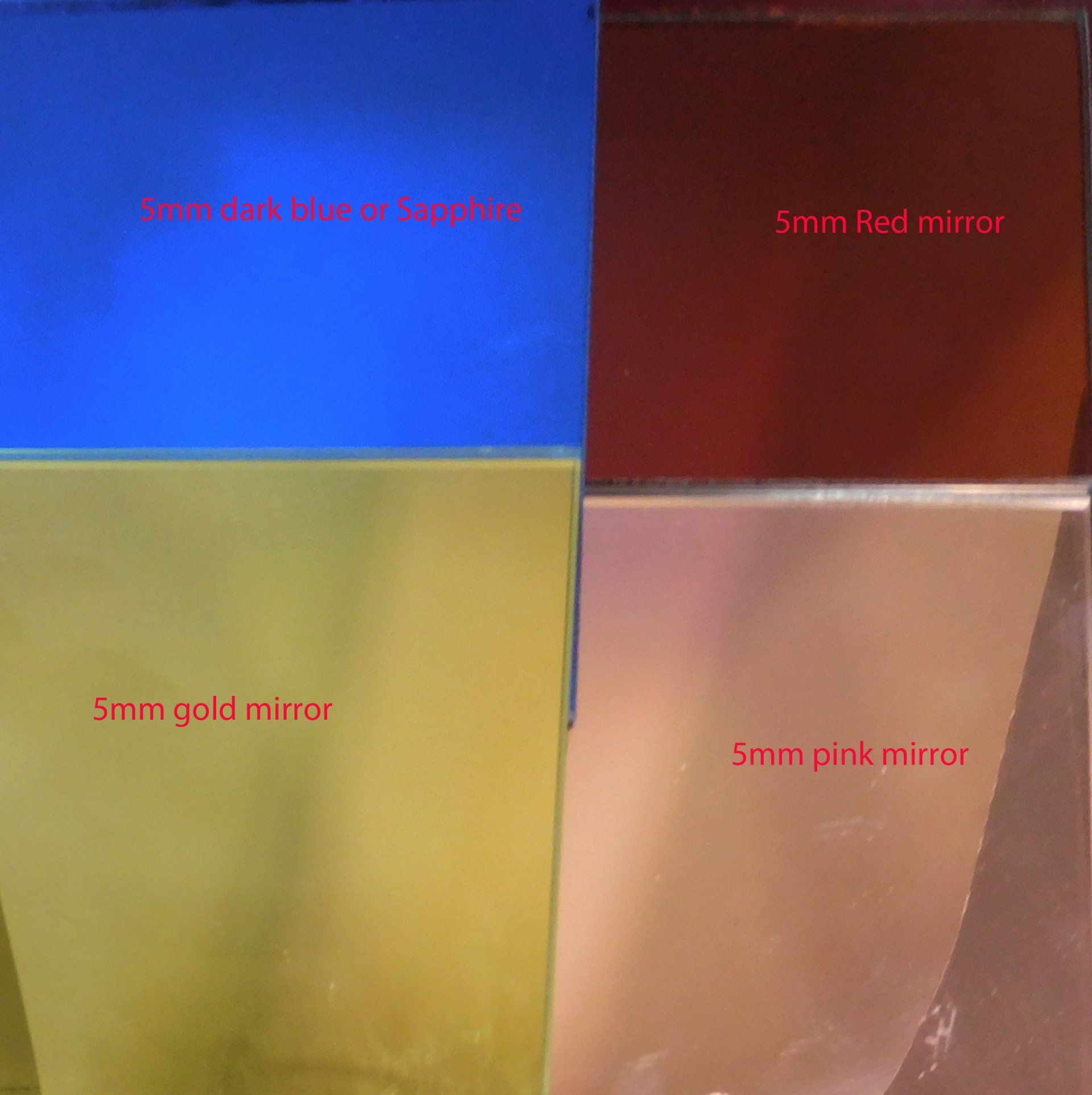 Four colored mirror tiles in a 2x2 grid: blue, red, gold, and pink.