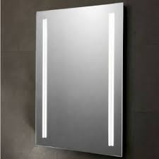 Rectangular bathroom mirror with two vertical LED light strips on a dark wall