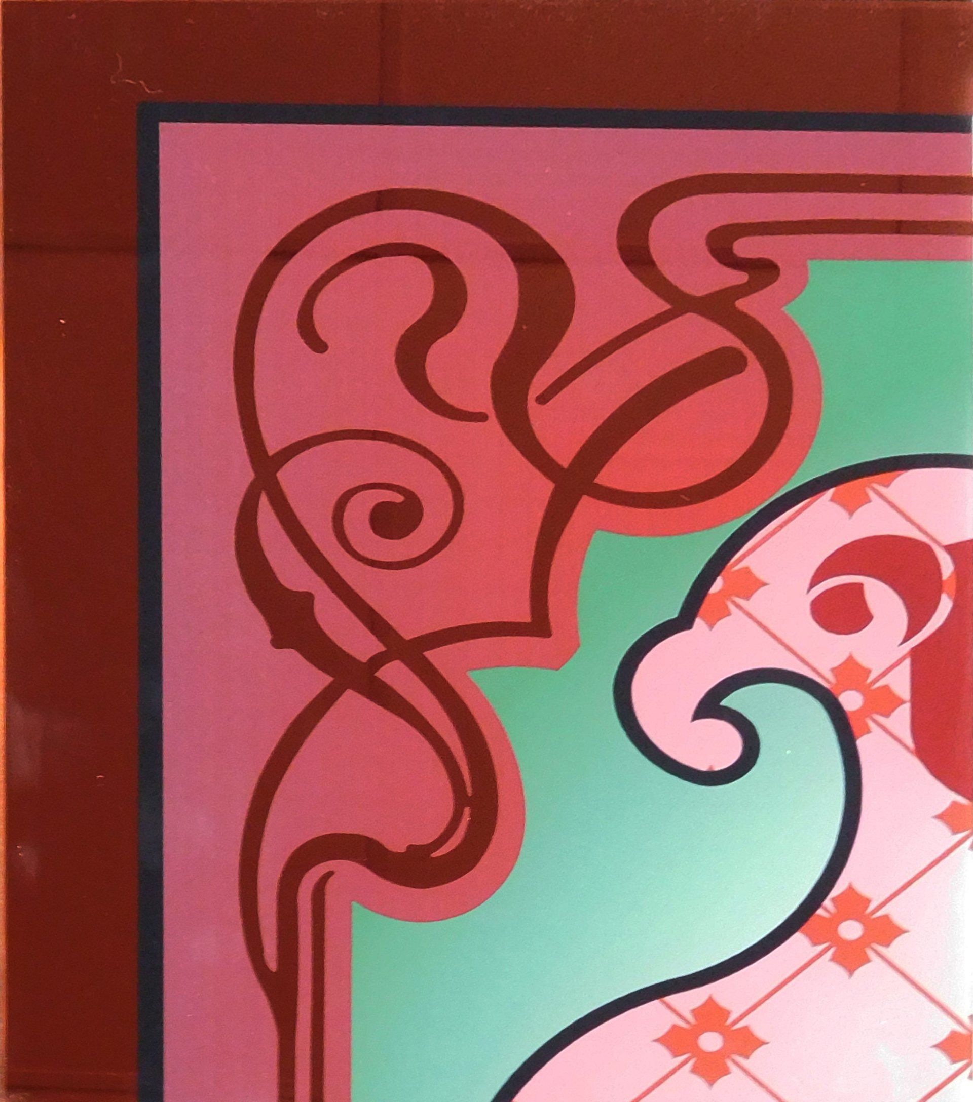 Abstract floral pattern in pink, green, and red with swirling line art on a decorative panel