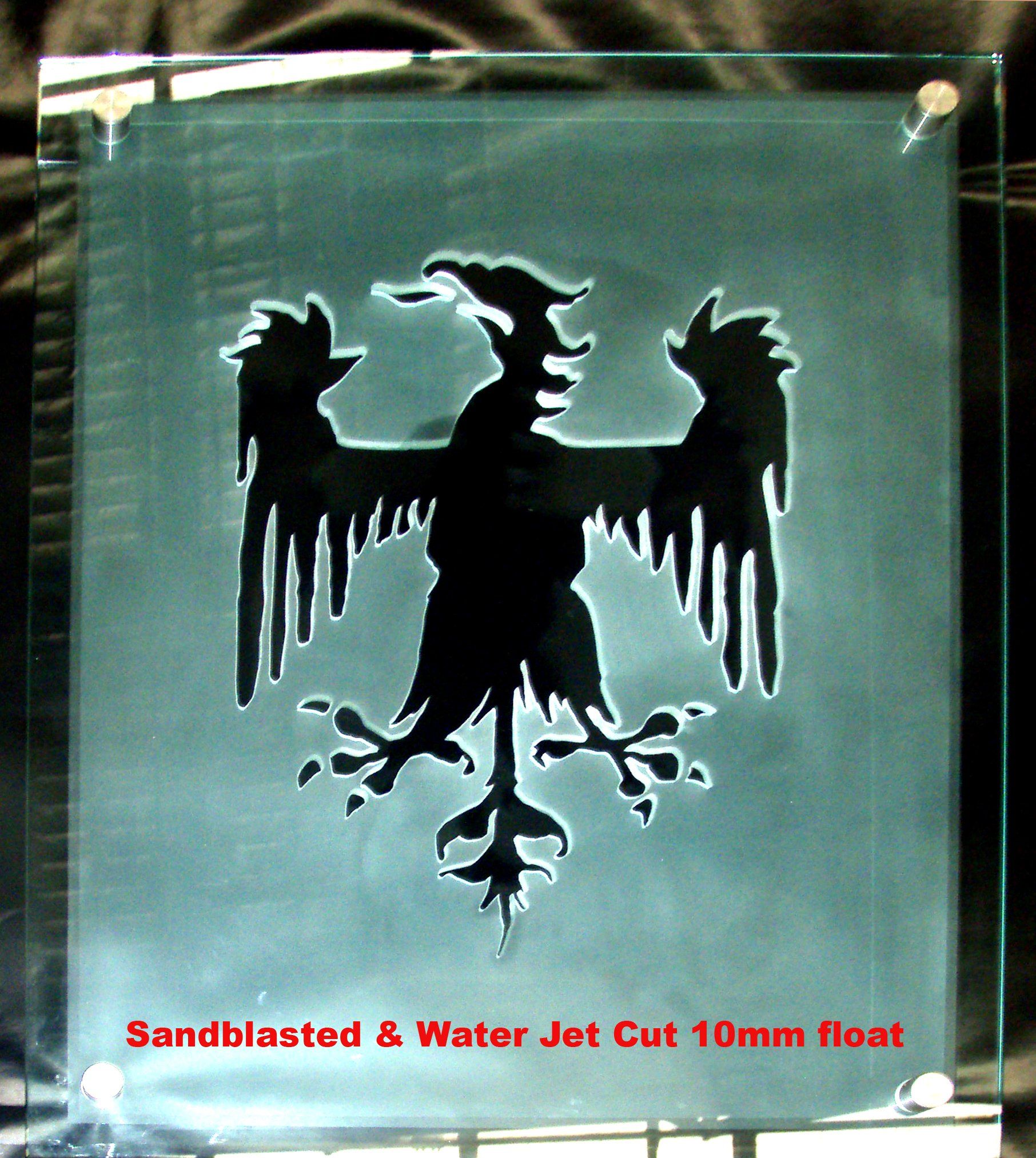 Black eagle silhouette etched on a glass panel with a pale blue background and red text at the bottom