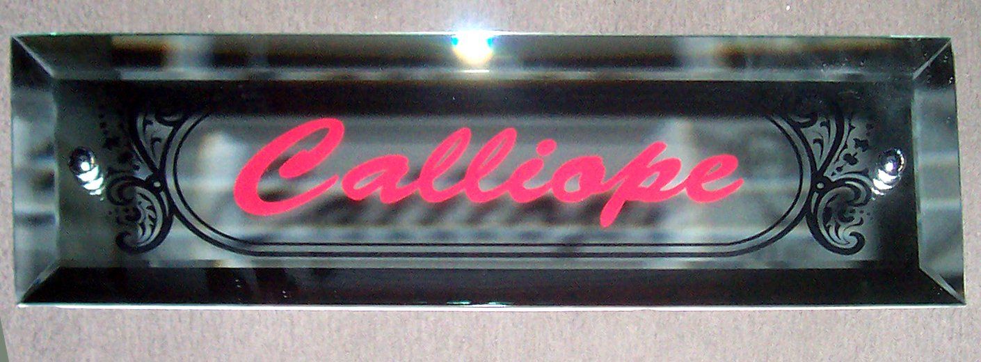 Pink “Calliope” logo on a black rectangular sign with decorative flourishes.