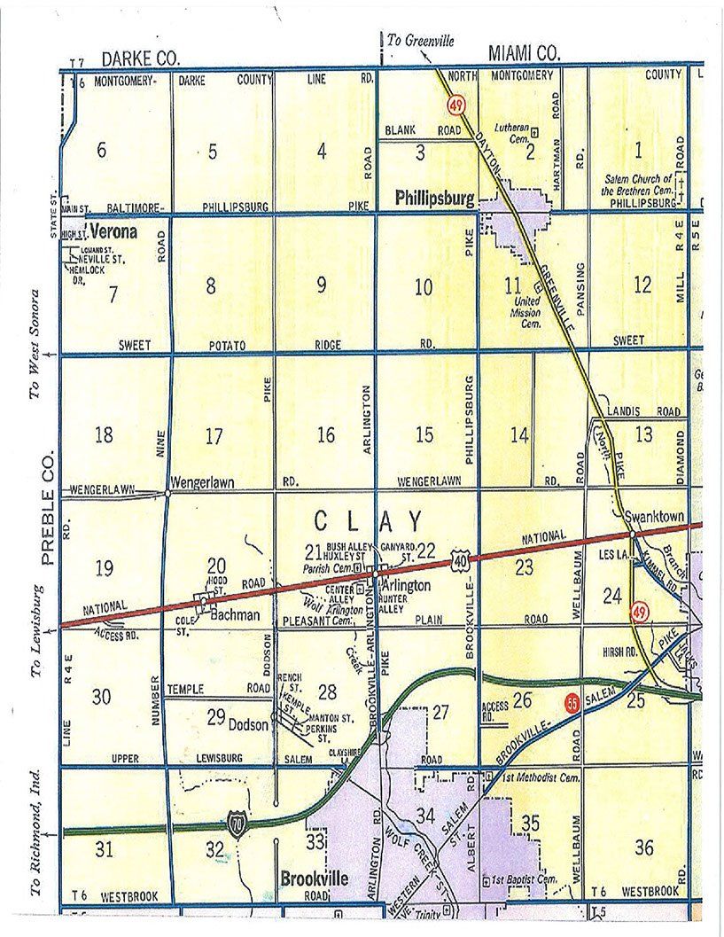 Map of land sections, roads, and a town in shades of yellow, blue, and brown.