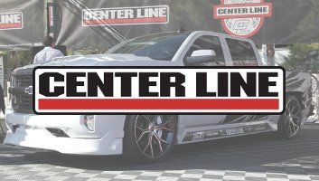 Center Line logo overlaying a customized white pickup truck with custom wheels at an outdoor event.