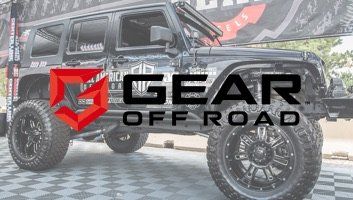 Black Jeep Wrangler with Gear Off Road logo. Red logo with black lettering.