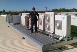 HVAC contractors inspecting a unit in Kailua-Kona, HI
