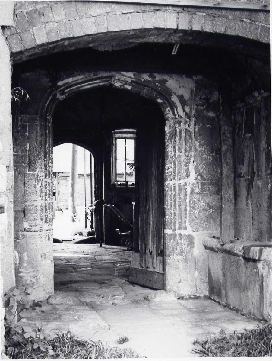 A black and white photo of a doorway in Acton Court