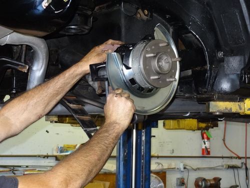 Man Repairing Car Brake — Orangevale, CA — Steve's Small Car Repair Man Repairing Car Brake — Orangevale, CA — Steve's Small Car Repair