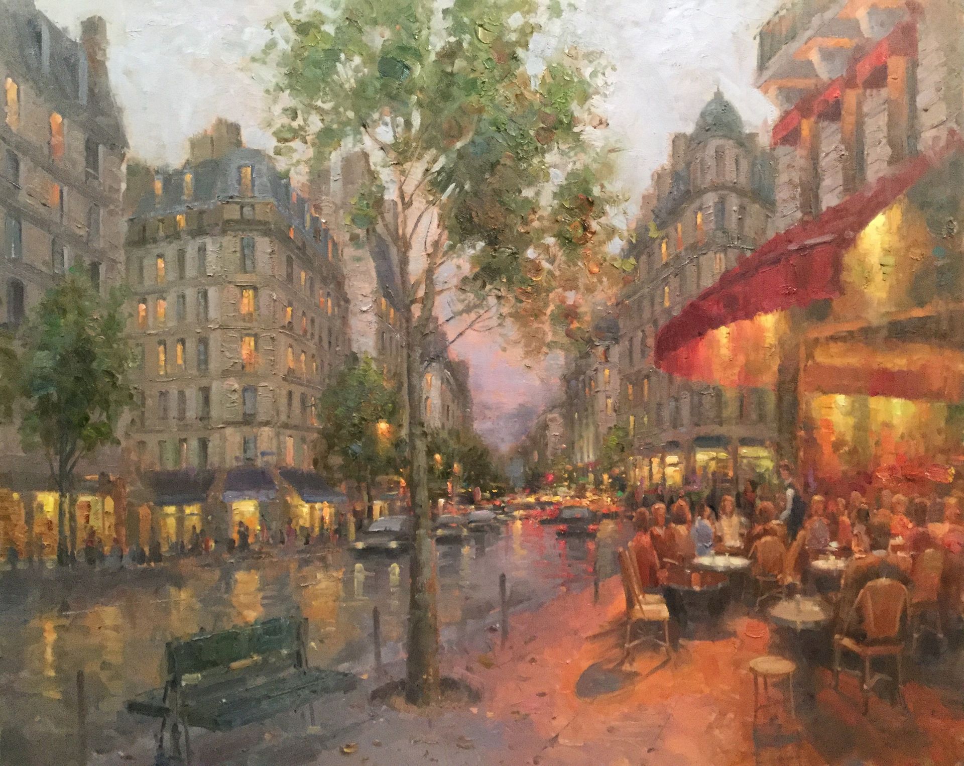 A painting of a city street at night with people sitting at tables.
