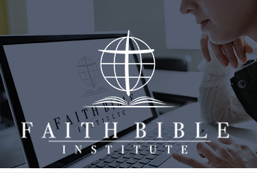 A woman looking at a Faith Bible Institute laptop.