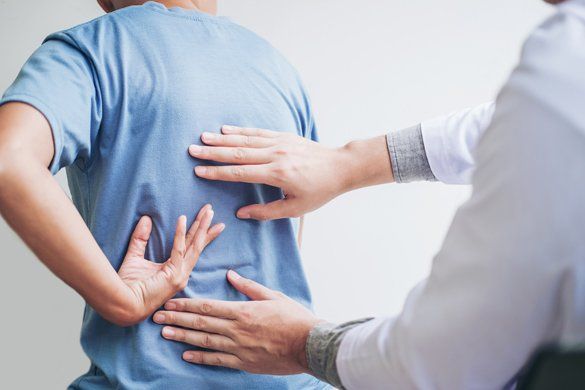 Patient having a back pain checkup — Jersey City, NJ — Pain and Disability Institute Patient having a back pain checkup — Jersey City, NJ — Pain and Disability Institute
