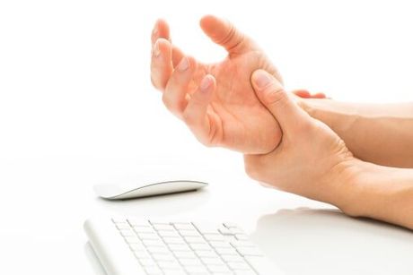 Man suffering with arm numbness — Jersey City, NJ — Pain and Disability Institute Man suffering with arm numbness — Jersey City, NJ — Pain and Disability Institute