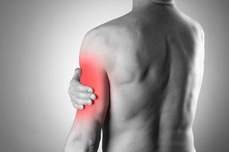 Man with biceps pain — Jersey City, NJ — Pain and Disability Institute Man with biceps pain — Jersey City, NJ — Pain and Disability Institute