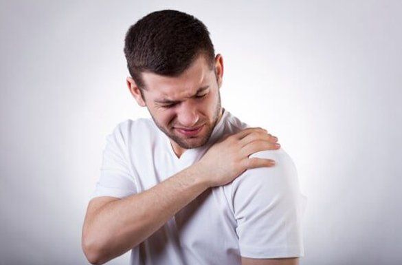 Man having a left shoulder pain — Jersey City, NJ — Pain and Disability Institute Man having a left shoulder pain — Jersey City, NJ — Pain and Disability Institute