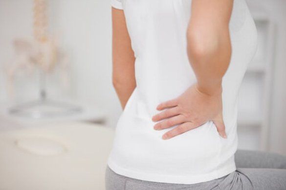 Middle age woman having lower back pain — Jersey City, NJ — Pain and Disability Institute Middle age woman having lower back pain — Jersey City, NJ — Pain and Disability Institute