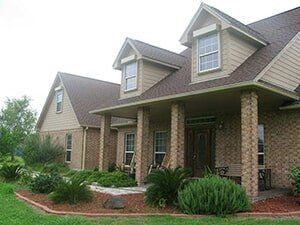 Hurricane Shutters Ormond Beach FL — House with Durable Shutter in Ormond Beach, FL Hurricane Shutters Ormond Beach FL — House with Durable Shutter in Ormond Beach, FL