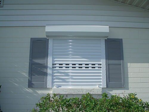 Hurricane Shutters Ormond Beach FL — House with Window Storm Shutter in Ormond Beach, FL