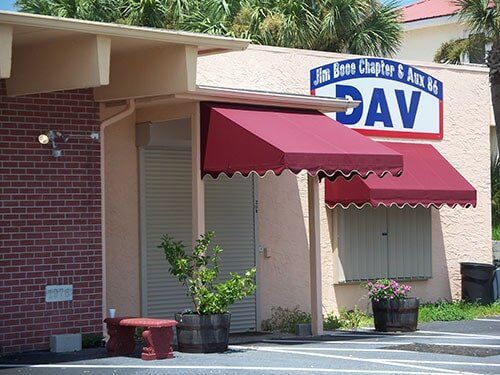Hurricane Shutters Ormond Beach FL — Commercial Establishment with Roll-up Shutter in Ormond Beach, FL