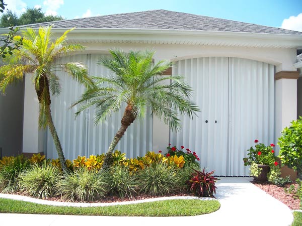 Accordion protecting doors and windows — hurricane shutters Ormond Beach FL in Ormond Beach, FL