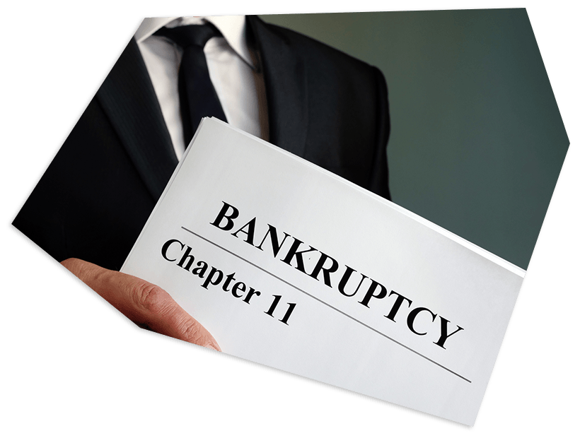 Man holding bankruptcy document — Schenectady, NY — James Trauring & Associates, LLC Man holding bankruptcy document — Schenectady, NY — James Trauring & Associates, LLC