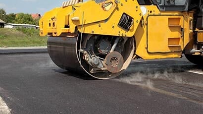 Huge machine paving asphalt - Asphalt Paving in Decatur, IL