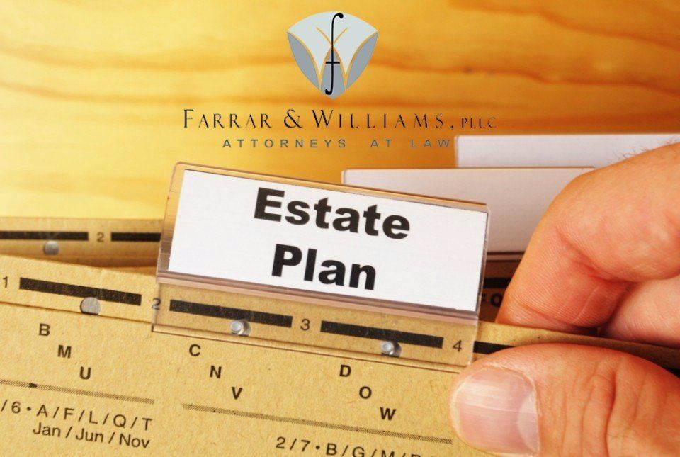 A person is holding a piece of paper that says estate plan