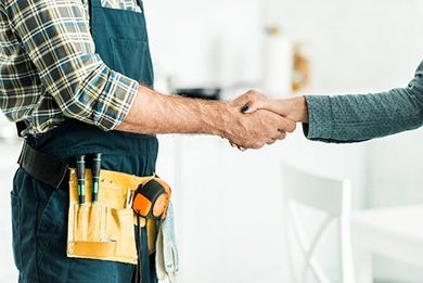 Kitchen Sink — Plumber and Client Shaking Hands in Kitchen in Goldsboro, NC Kitchen Sink — Plumber and Client Shaking Hands in Kitchen in Goldsboro, NC