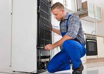 Repairman fixing the Refrigerator — The Other Guy Appliance Repair in Kansas City, KS Repairman fixing the Refrigerator — The Other Guy Appliance Repair in Kansas City, KS