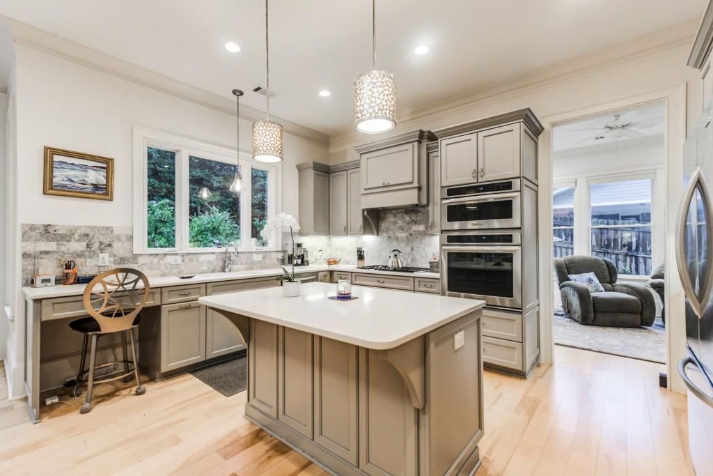 A kitchen with a large island in the middle of it.