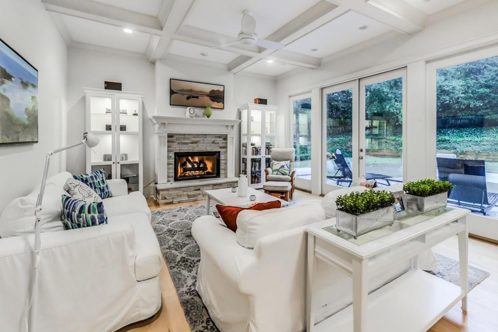 A living room filled with furniture and a fireplace.