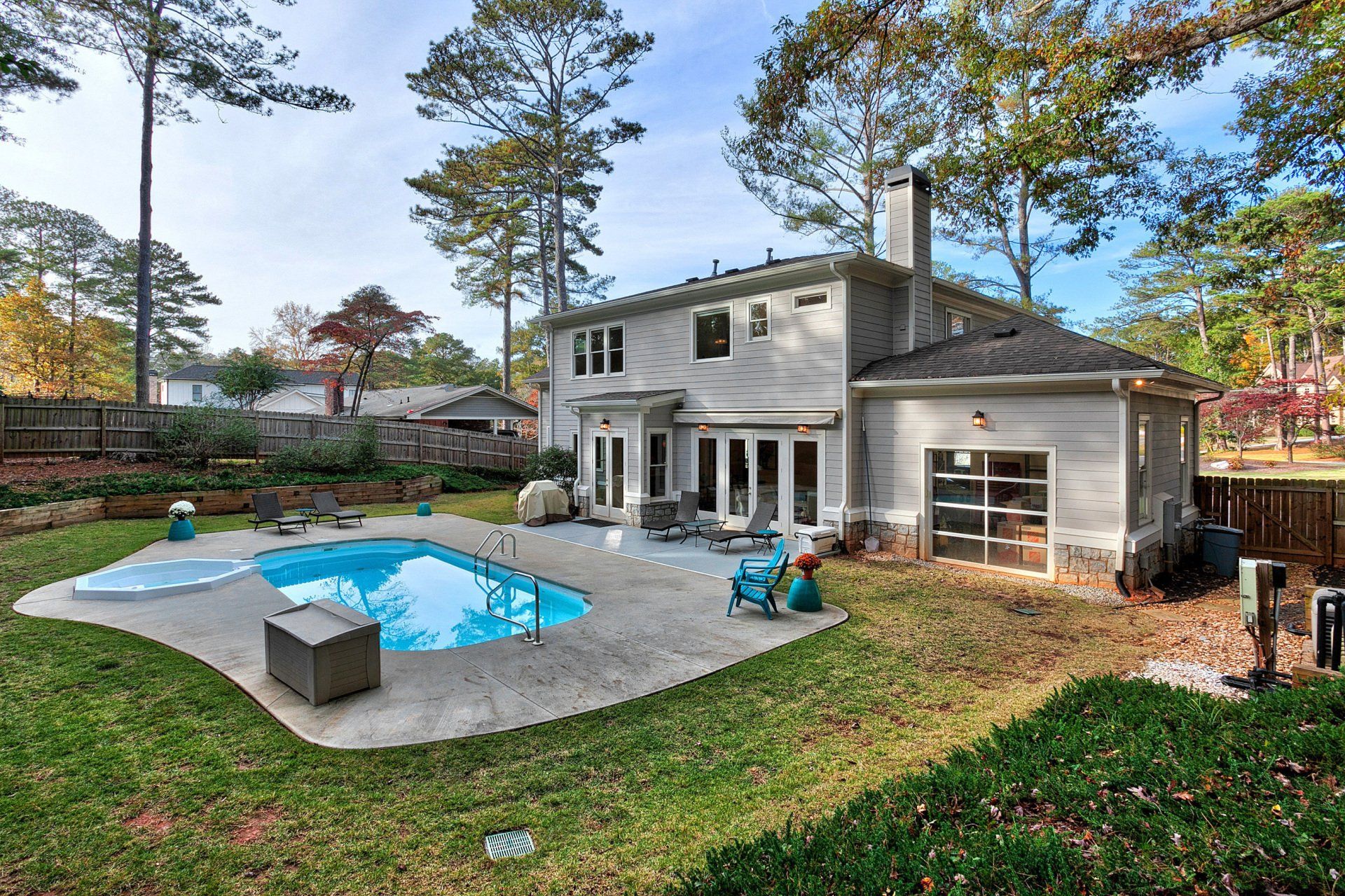 A large house with a large swimming pool in the backyard.