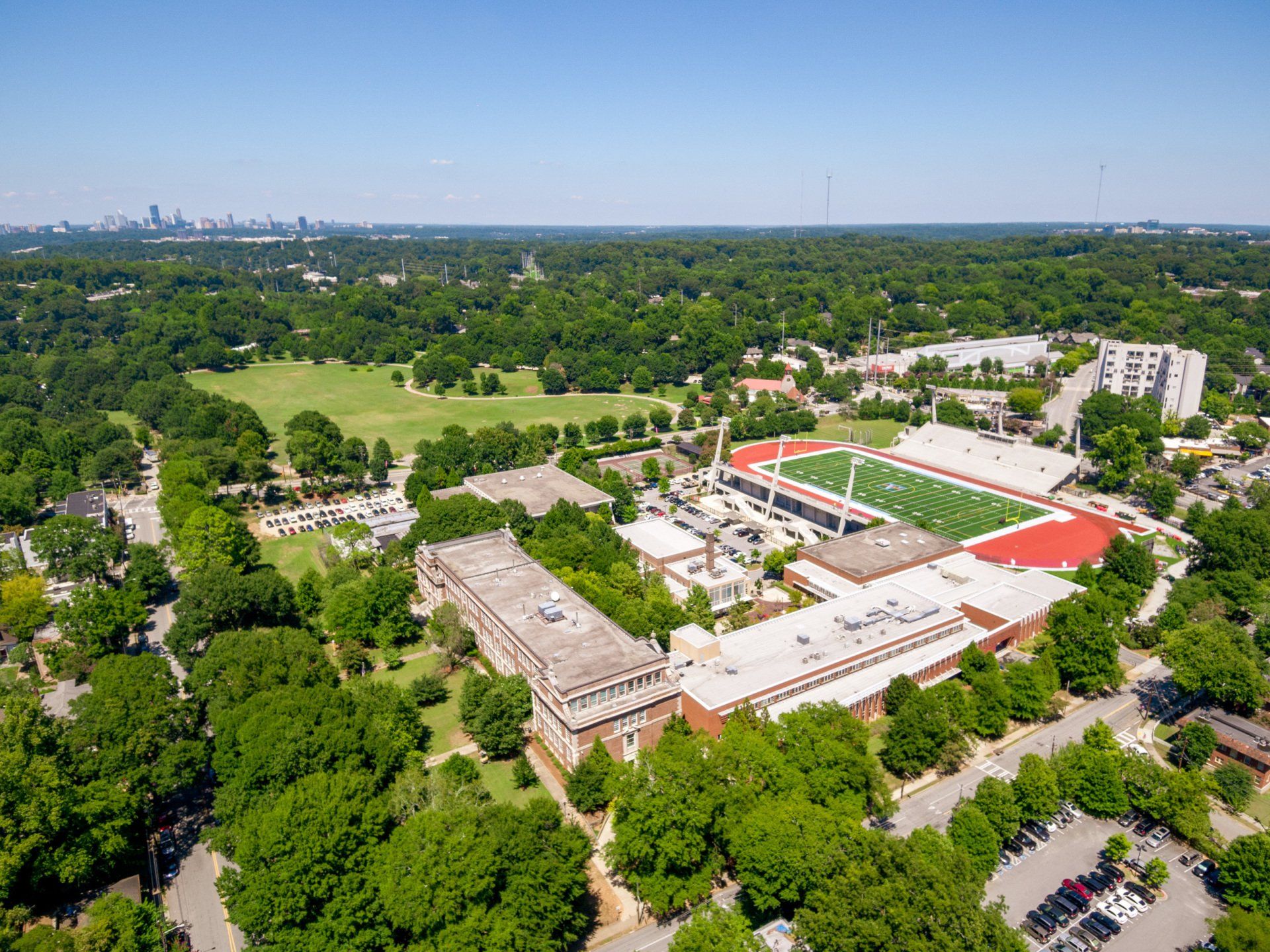 An aerial view of a college campus surrounded by trees and buildings.