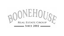 The logo for boonehouse real estate group since 2002.