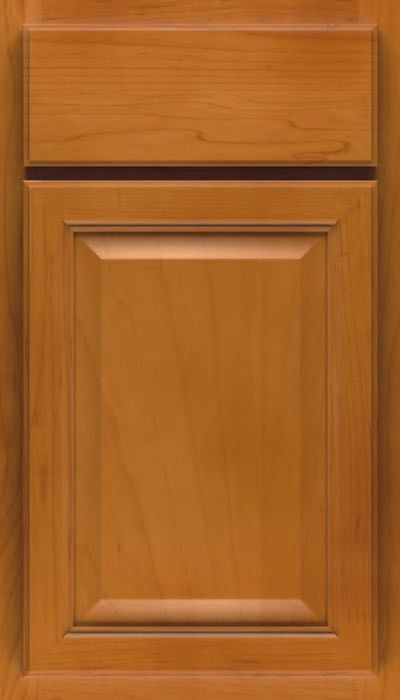Wooden kitchen cabinet door with a matching top drawer.